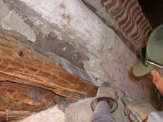 Preparing to remove old wood (white rot) from the Tumacacori Mission church at Tumacacori National Historical Park